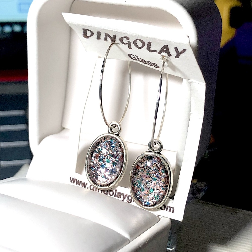 Hand painted glass dome earrings.